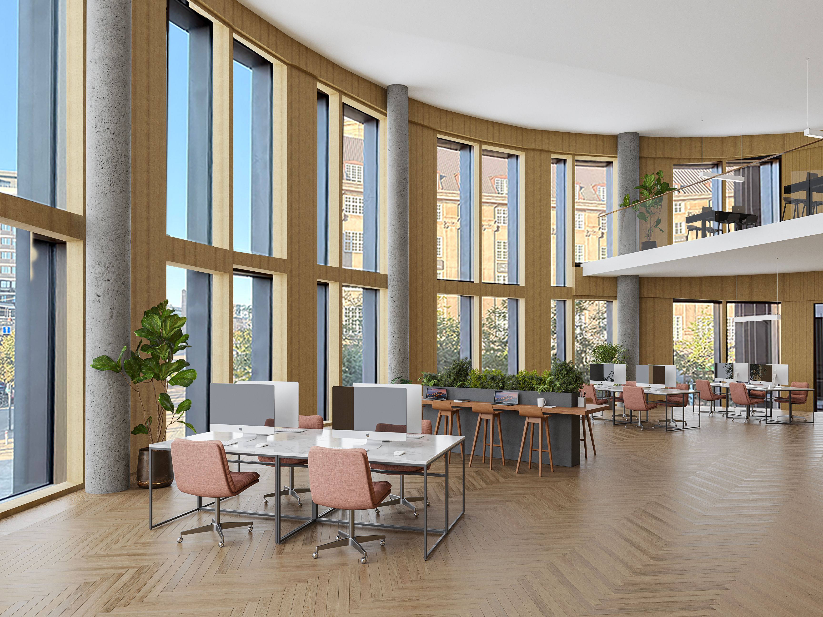 Stort kontor med højt loft, lyse vinduer og masser af plantevækst. De mange borde og stole er arrangeret rundt om kontoret. Lysindfaldet og udsigten til Tivoli er enestående.