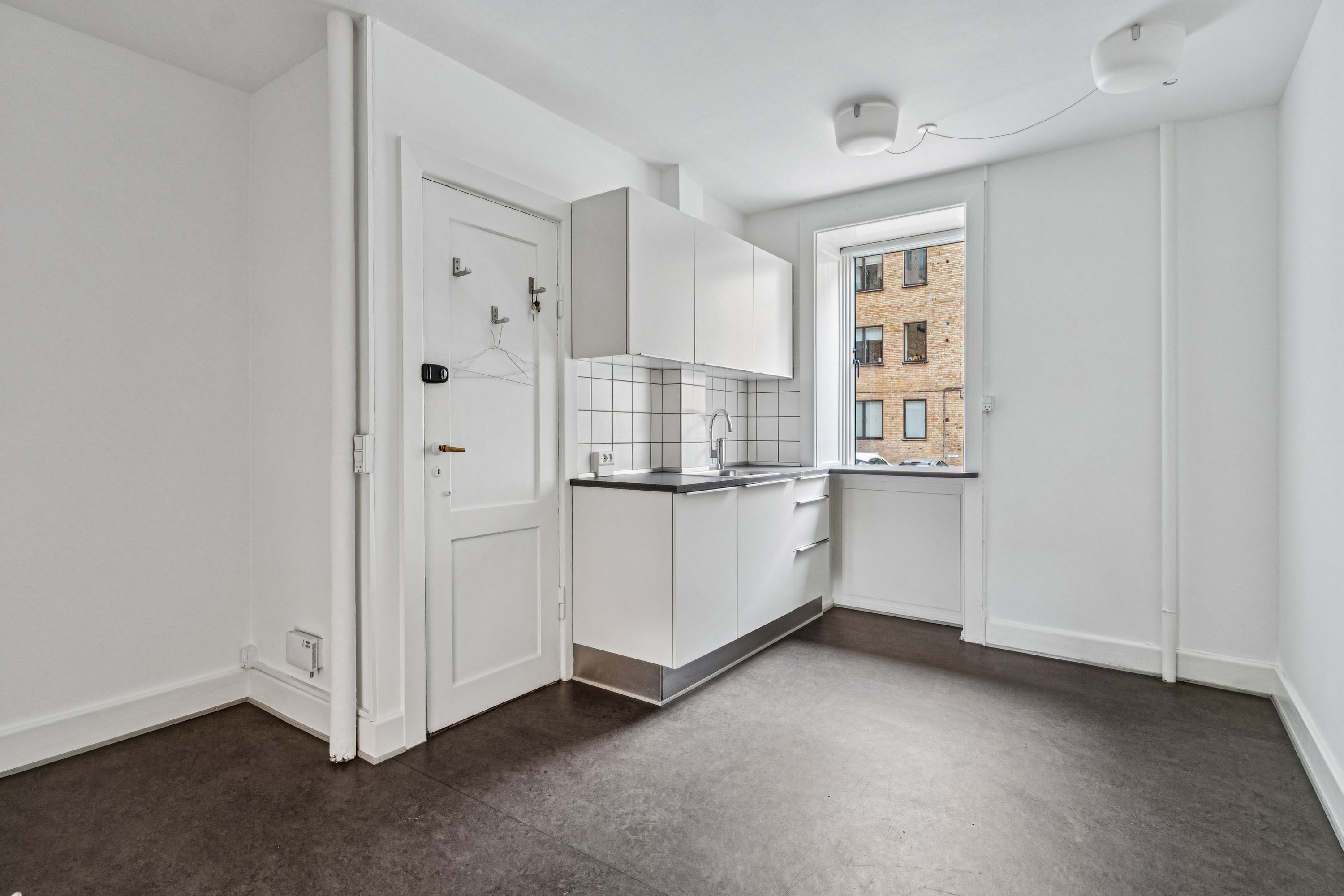 Rentabel butik til leje på Søndre Fasanvej 45 i Frederiksberg med højloftet stueplan og fint baglokale mod gården