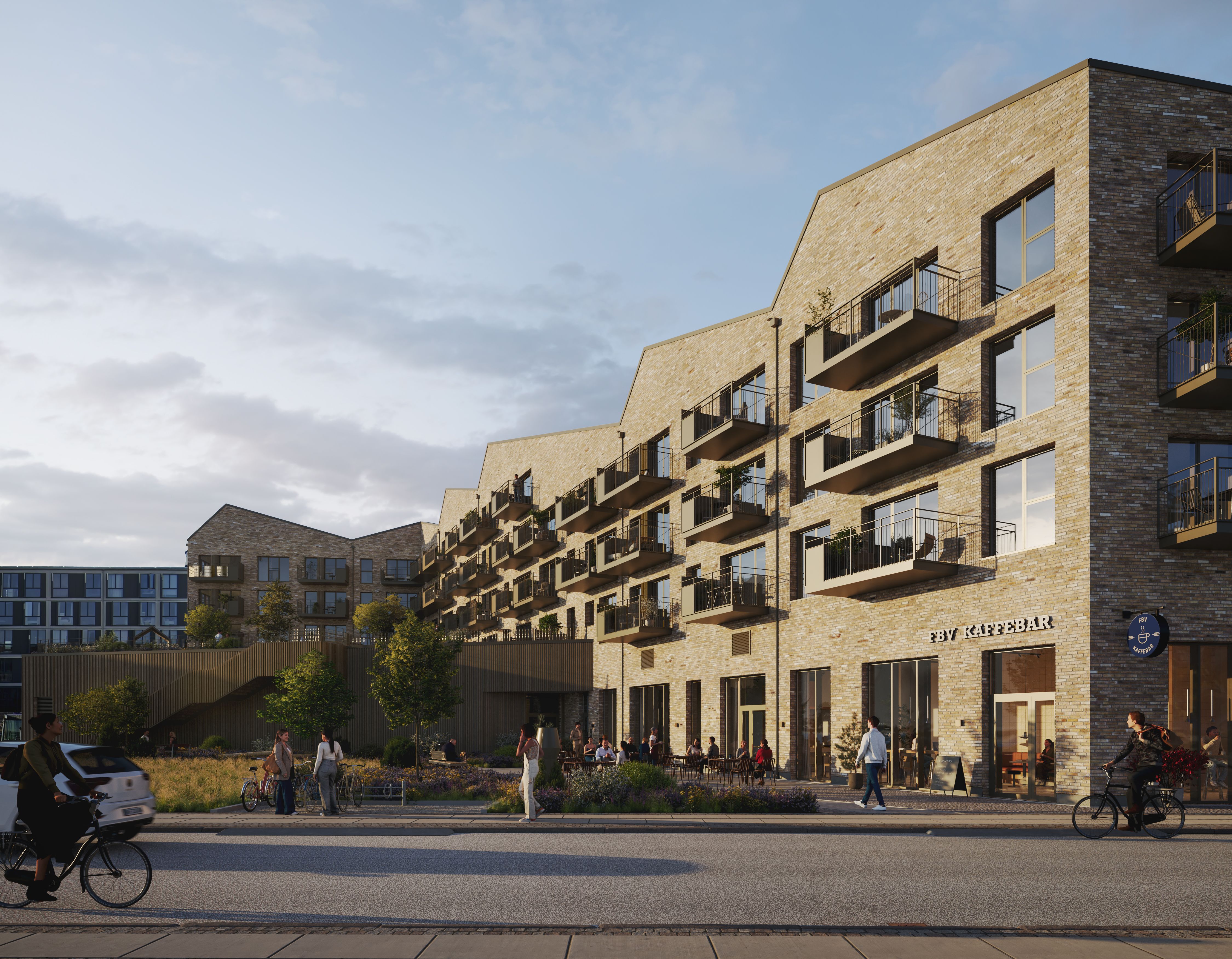 En restaurant med cafebar i københavnske Frederiksborgvej. Bygningen med moderne glasvinduer og balkoner. Mennesker cykler og går langs fortovet. En bil parkeret ved siden af.