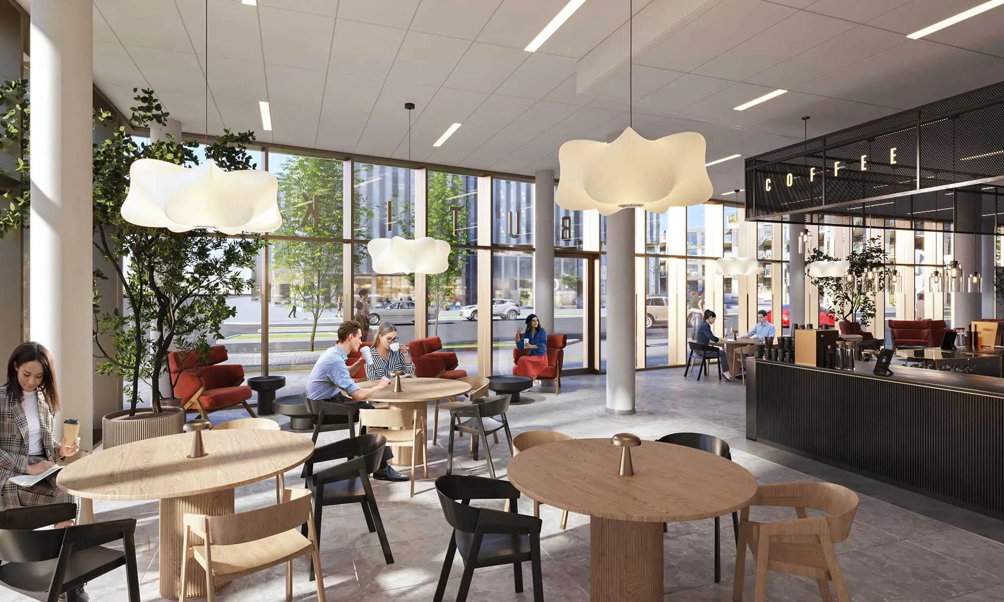 Moderne interiør med runde borde og stole, hængelampe og plante, eksklusivt område med sofaer og kaffebar