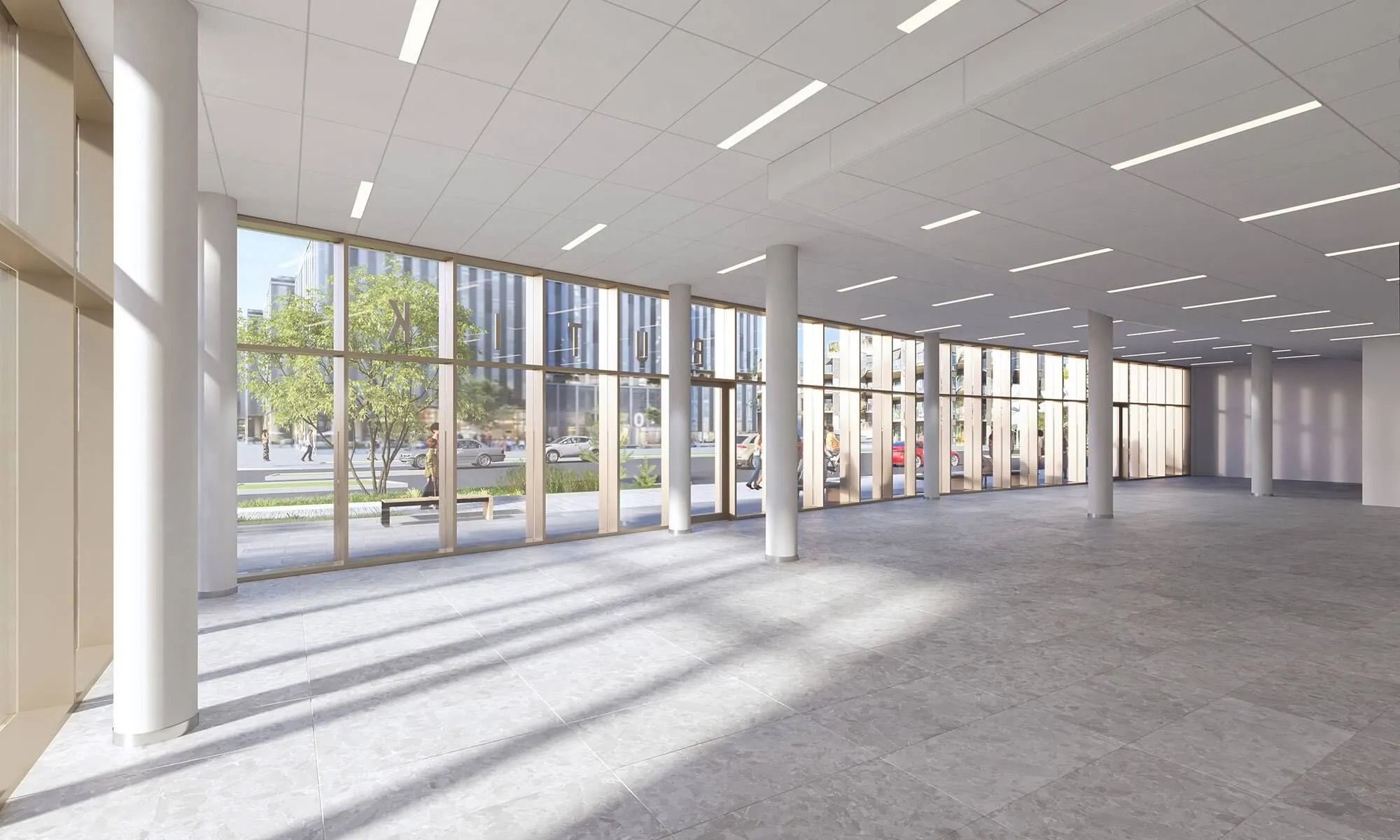 Et stort og luksuriøst kontor med gulv af sten og store vinduer med udsigt til byen og trafik