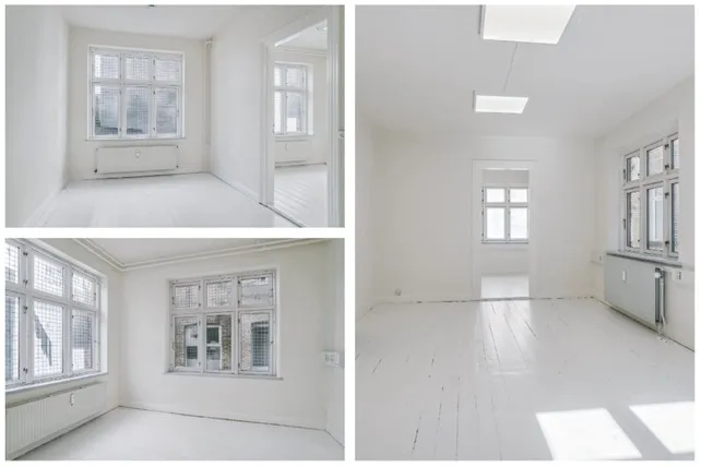 Køkken, stue og 3 værelser med 2 badeværelser på 255 m² i 3 etager. Foto af kontorlokaler med hvide vægge og gulv samt store