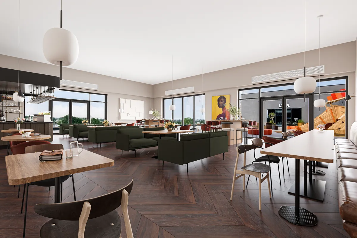 En moderne, elegant og rummelig restaurant med lyse loftslampe, trægulve, grønne stole, runde og firkantede borde og et