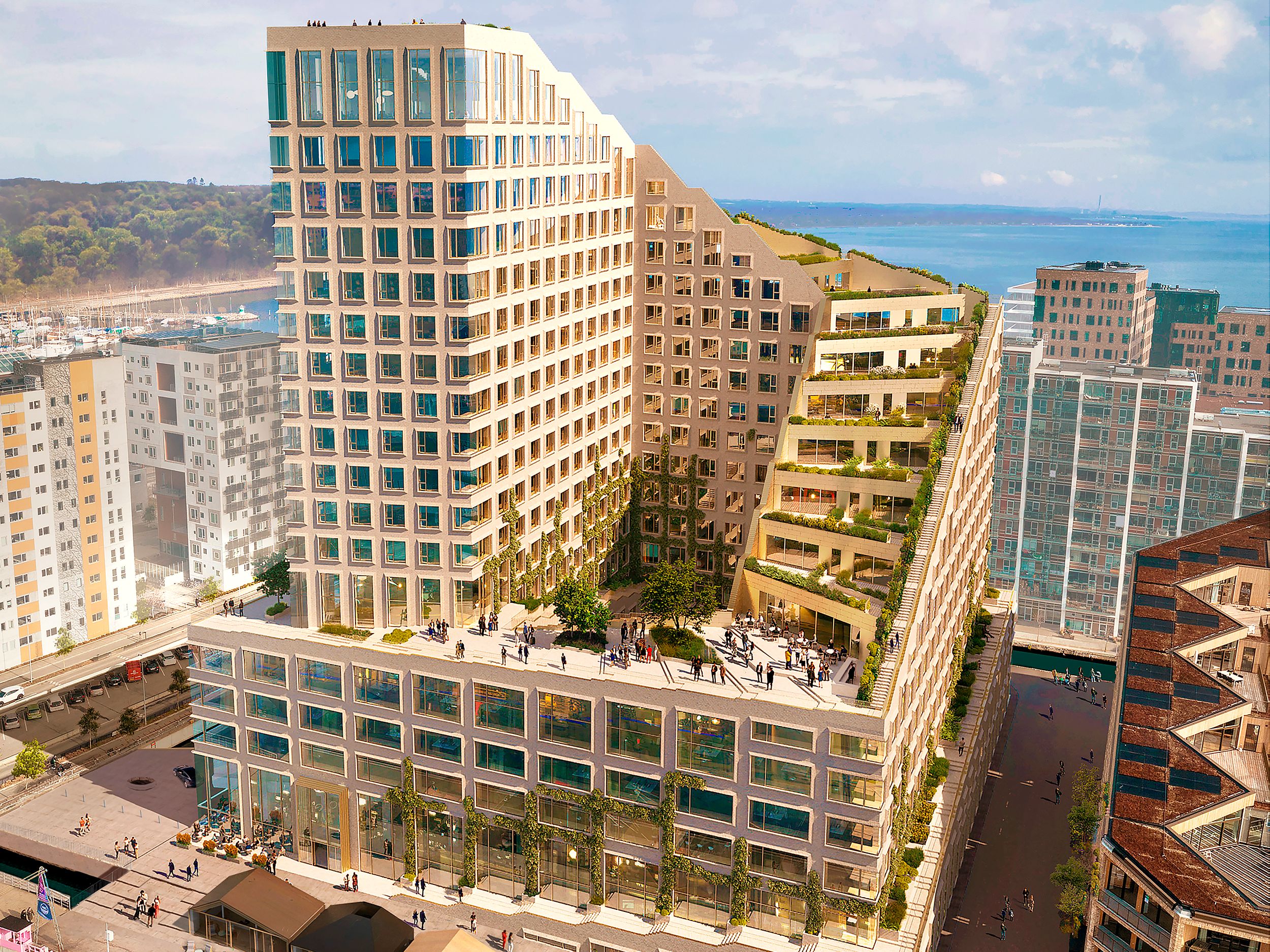 En ny hotel- og erhvervsbygning med grønne tagterrasser og mange kontorer på Aarhus Ø