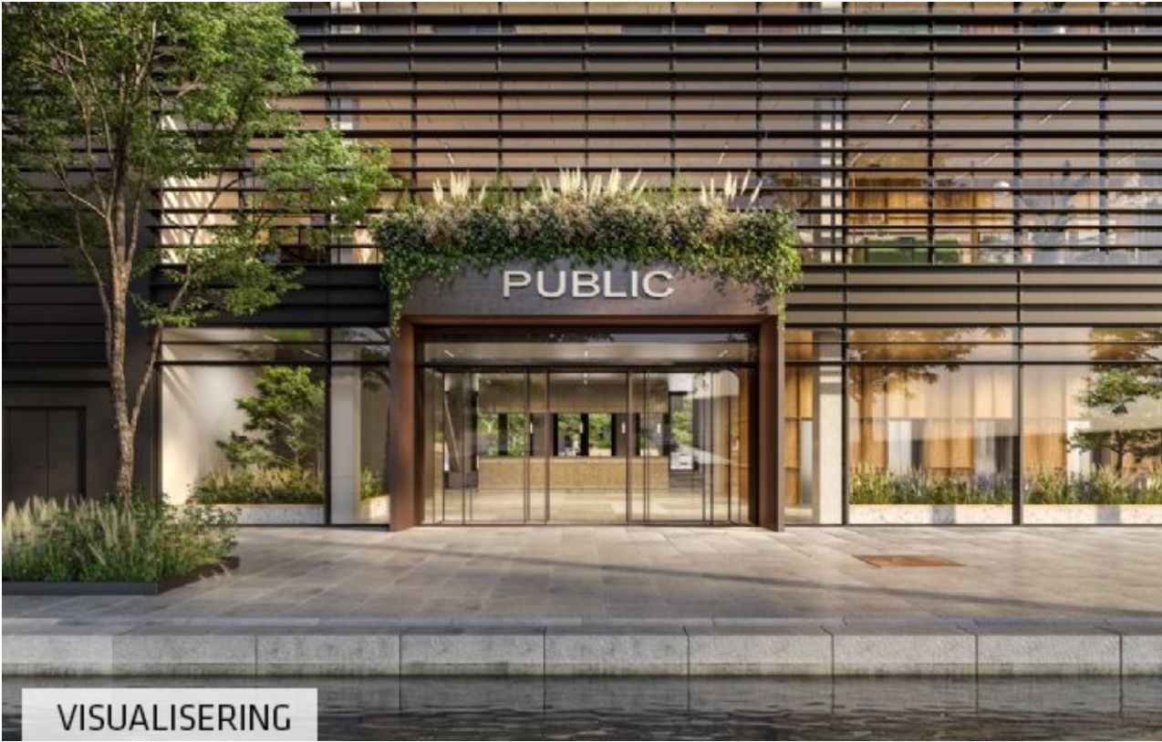 Moderne og stilfuldt kontorbygning med en stor indgang og en stor "Public" skilt på facaden